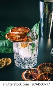 Dehydrated Citrus Fruit Oranges Blood Orange And Lemon Dragon Fruit Cocktail In A Glass With Ice Spash Tonic Black Background Product Photography Citrus Wheels Nightlife