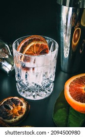 Dehydrated Citrus Fruit Oranges Blood Orange And Lemon Dragon Fruit Cocktail In A Glass With Ice Spash Tonic Black Background Product Photography Citrus Wheels Nightlife