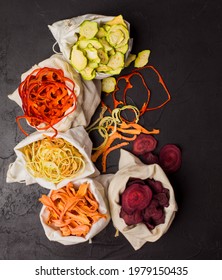 Dehydrated vegetables in textile bags on black background