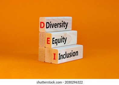 DEI, Diversity, equity, inclusion symbol. Wooden blocks with words DEI, diversity, equity, inclusion on beautiful orange background. Business, DEI, diversity, equity, inclusion concept.