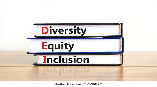 DEI, Diversity, equity, inclusion symbol. Books with words DEI, diversity, equity, inclusion on beautiful wooden table, white background. Business, DEI, diversity, equity, inclusion concept. - Shutterstock ID 2042398376