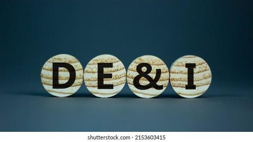 DEI, Diversity, equity and inclusion symbol. Concept words DEI, diversity, equity and inclusion on wooden circles on beautiful grey background. Business, DEI, diversity, equity and inclusion concept.