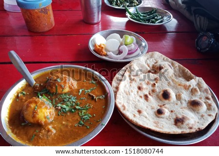 the deicious egg curry with indian bread