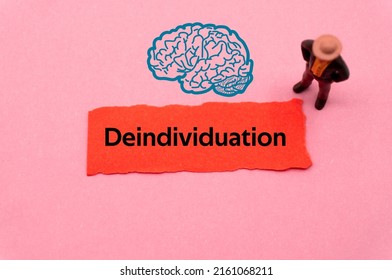 Deindividuation.The word is written on a slip of colored paper. Psychological terms, psychologic words, Spiritual terminology. psychiatric research. Mental Health Buzzwords. - Shutterstock ID 2161068211