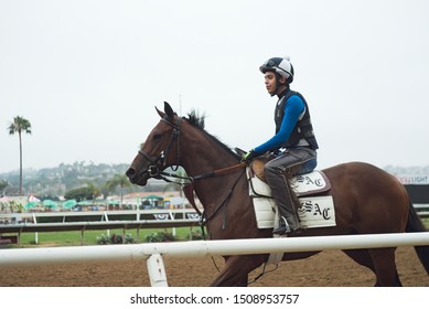 Del Mar, CAUSA 9119 Jockey And Race Horse On Dirt Track For Morning Workout At Del Mar Thoroughbred Club Horse Racing Track Near San Diego. Observed During 