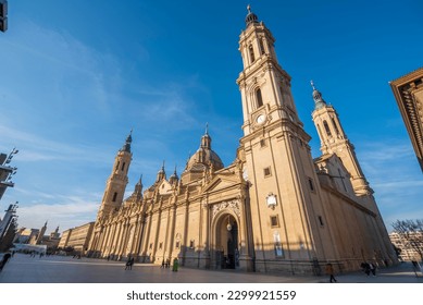 del Pilar basilica, one of the important architectural symbols of zaragoza, and the Ebro river and its reflection with sunset colors and clouds