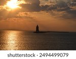 Delaware Breakwater Lighthouse at Cape Henlopen State Park in Lewes Delaware at Sunset