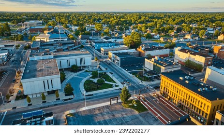 Delaware County Court Administration courthouse building and Muncie, IN city aerial at sunset - Shutterstock ID 2392202277