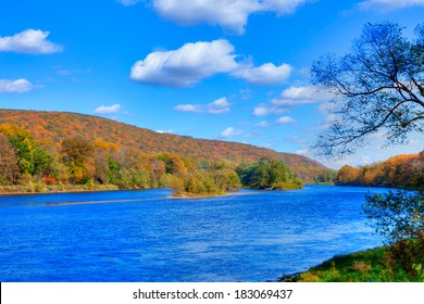Delaware Water Gap in Autumn with colorful foliage with forest and mountain over river.