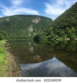 The Delaware Water Gap National Recreation Area protects the natural environment along the Delaware River that serves as the boundary of New Jersey and Pennsylvania