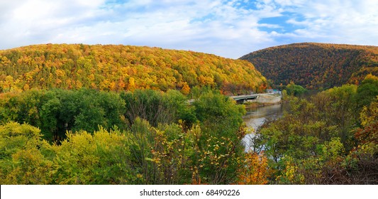 Delaware Water Gap panorama in Autumn with colorful foliage with forest and mountain over river.