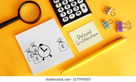 Delayed gratification is shown using a text - Shutterstock ID 2177974357