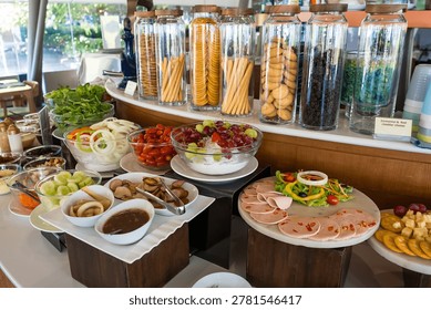 Delectable Buffet Spread: A lavish spread of culinary delights awaits, featuring a vibrant array of fresh salads, savory snacks, and appetizing dishes, perfect for a feast for the senses.