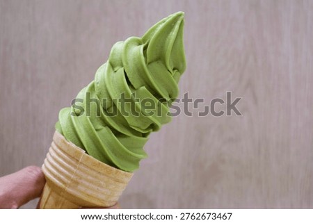 Delectable Matcha Green Tea Soft Serve Ice Cream in Hand