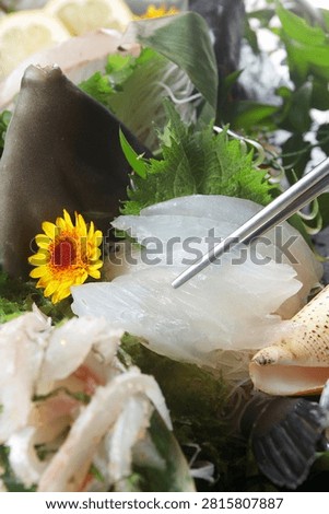 A delectable serving of fresh sashimi, a classic Japanese and Korean delicacy.