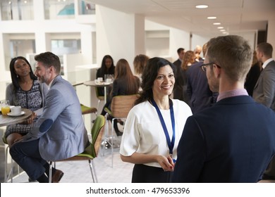 Delegates Networking During Coffee Break At Conference