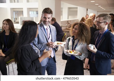 Delegates Networking During Conference Lunch Break - Powered by Shutterstock