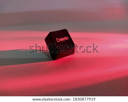 Delete button keyboard on red color background.