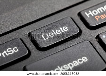 Delete key, del button on a laptop keyboard, object macro, extreme closeup, detail. User file deletion, traces removal, erasing information, getting rid of digital data abstract concept, nobody