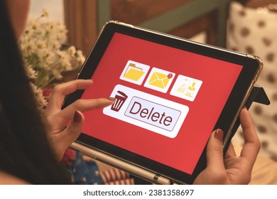 Deleting documents, junk mail, electronic messages or personal information in tablet system. Concepts of technology and document management from online platforms - Powered by Shutterstock - Get 15% off with code: PIKWIZARD15