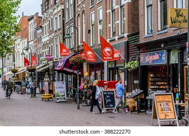 DELFT, THE NETHERLANDS - JUNE 17, 2014: City landscape of old town. Delft - beautifully preserved historic city - from a rural village in the early Middle Ages Delft developed to a city.