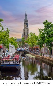 Delft, Netherlands - June 2019: Delft canals and New church tower