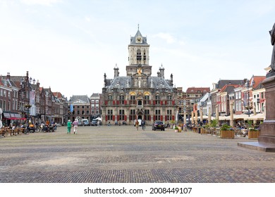 Delft, The Netherlands, June 2021: City Hall and Market Square in Delft, South Holland, Netherlands. Delft is an old Dutch city that is known for its pottery, canals and the painter Vermeer.
