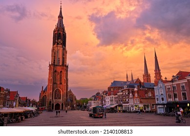 Delft, Netherlands - May 12, 2017: Nieuwe Kerk New Church protestant church on Delft Market Square Markt with dramatic sky on sunset. Delft, Netherlands