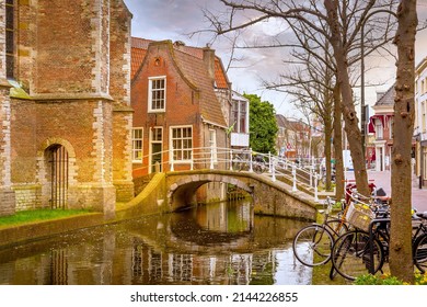 Delft, Netherlands street view with traditional dutch houses, bridge, canal in downtown of popular Holland town