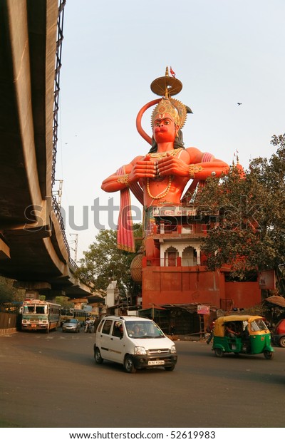 DELHI - FEBRUARY 24.\
Hanuman rising above street and metro flyover on February 24, 2008\
in Delhi, India. This temple has survived the onslaught of urbanism\
and pollution.