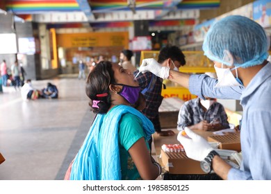 Delhi, India - 06-02-2021 - A Medical Worker Takes A Swab Sample  For A Reverse Transcription Polymerase Chain Reaction (RT-PCR) Test For Covid-19 During Random Testing At Railway Station In Delhi.