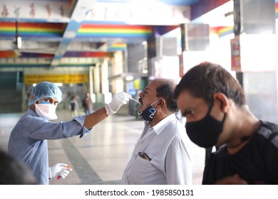 Delhi, India - 06-02-2021 - A Medical Worker Takes A Swab Sample  For A Reverse Transcription Polymerase Chain Reaction (RT-PCR) Test For Covid-19 During Random Testing At Railway Station In Delhi.