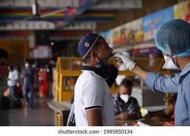 Delhi, India - 06-02-2021 - A Medical Worker Takes A Swab Sample  For A Reverse Transcription Polymerase Chain Reaction (RT-PCR) Test For Covid-19 During Random Testing At Railway Station In Delhi.