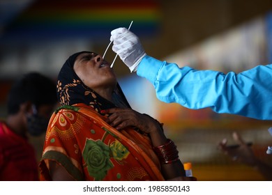 Delhi, India - 06-02-2021 - A Medical Worker Takes A Swab Sample  For A Reverse Transcription Polymerase Chain Reaction (RT-PCR) Test For Covid-19 During Random Testing At Railway Station In Delhi.