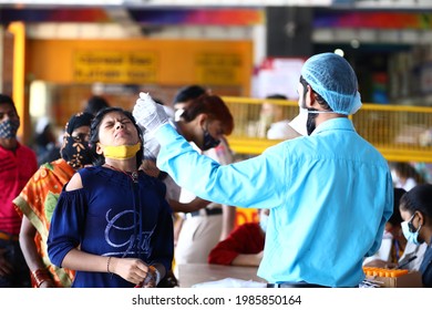 Delhi, India - 06-02-2021 - A Medical Worker Takes A Swab Sample  For A Reverse Transcription Polymerase Chain Reaction (RT-PCR) Test For Covid-19 During Random Testing At Railway Station In Delhi.