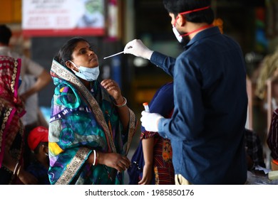 Delhi, India - 06-02-2021 - A Medical Worker Takes A Swab Sample  For A Reverse Transcription Polymerase Chain Reaction (RT-PCR) Test For Covid-19 During Random Testing At Railway Station In Delhi.