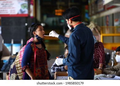 Delhi, India - 06-02-2021 - A Medical Worker Takes A Swab Sample  For A Reverse Transcription Polymerase Chain Reaction (RT-PCR) Test For Covid-19 During Random Testing At Railway Station In Delhi.