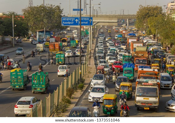 Delhi/ India -
09.02.2019: Traffic jams of indian traffic of various cargo and
urban transport, aerial
view