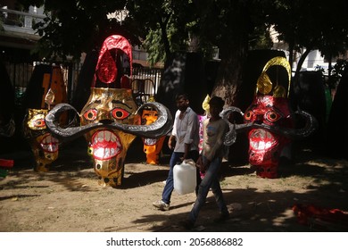 Delhi, India - 10-13-2021 - A Man Paints An Effigy Of The Demon King Ravana Ahead Of 'Dussehra' Festival Celebration In New Delhi.