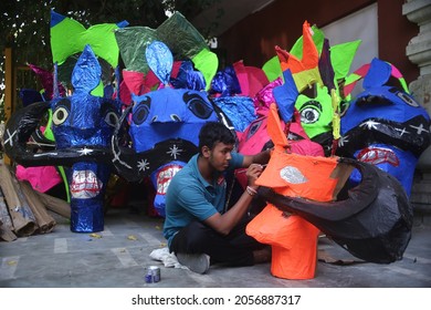 Delhi, India - 10-13-2021 - A Man Paints An Effigy Of The Demon King Ravana Ahead Of 'Dussehra' Festival Celebration In New Delhi.