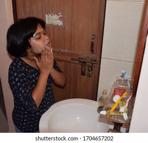 Delhi - India
15th April 2020

An Indian Child Washing Her Face And Hands In Wash Basin To Prevent The Spread Of Corona Virus Flu Or Covid 19