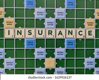 Delhi, India, 2020. Scrabble Tiles Used To Spell The Words Insurance On The Game Board. Scrabble Is Owned By The Toy Company Mattel. Health Insurance Are Popular Nowadays Due To Coronavirus (Covid-19)