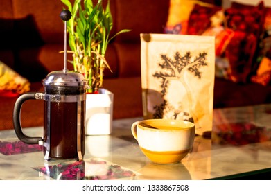 Delhi, India - Circa 2019: French Press Filled With Coffee, Cup, Bag Of Grounds Shot In Beautiful Morning Golden Light. Home Brewing Of Coffee Has Become A New Rage With Connoisseurs And Newbies Alike