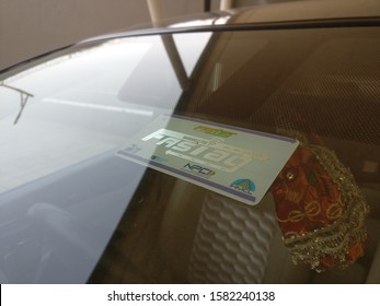 Delhi, India, Circa 2019 : The New FASTag Placed On The Windsheild Of A Car In India. This New Cashless Payment Technology For Toll Booths Had Been Made Mandatory By The NHAI 