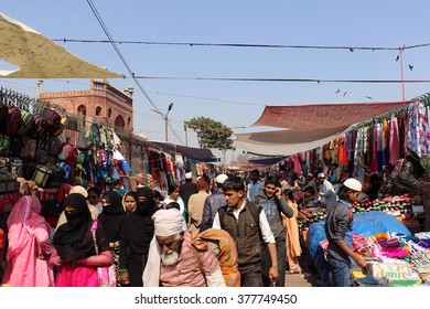 Delhi, India - February 16, 2016: Scene of people-packed market in front of Jama Masjid named Mina Bazar in morning time in old delhi, india.