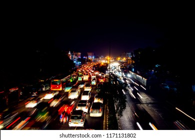 Delhi, India. Heavy car traffic in the city center of Delhi, India at night. Illuminated car trails