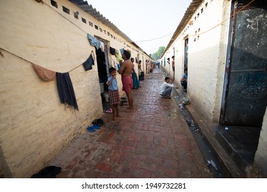 Delhi, India, June 6 2013: Migrant Labor Standing On House Door, A View Of Labor Colony Near Kapas Hera, Delhi Haryana Border. Life In These Rented Houses.