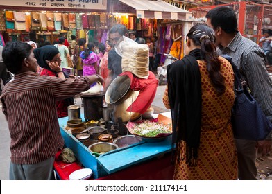 Delhi, India - March 09, 2013: Man Cooking And Selling Food On The Streets Of Delhi