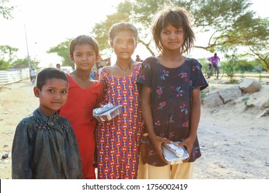 Delhi, India - May 16 2020 : Poor Children During Food Distribution By A Charitable Trust During Corona Pandemic.