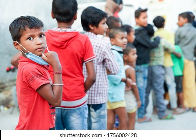 Delhi, India - May 16 2020 : Poor Children During Food Distribution By A Charitable Trust During Corona Pandemic.